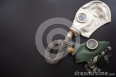 Codependent relationship, negative emotions, hazardous affair and toxic love concept with two gas masks connected on the same hose Stock Photo