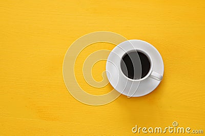 coffe cup on wooden yellow background Stock Photo