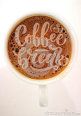 Lettering `coffee break` with coffee cup as background. Stock Photo