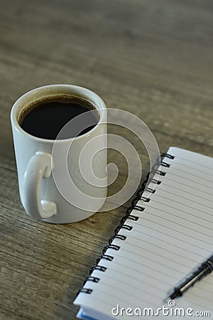 Coffee along a notepad for business man Stock Photo