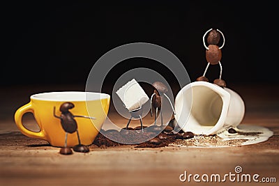 Coffee bean figures with a cup of coffee and sugar cubes Stock Photo