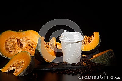 Coffee bean pumpkin spice latte nutrition recipie mock up. cut pumpkin coffee beans and white paper cup for coffee break with a Stock Photo