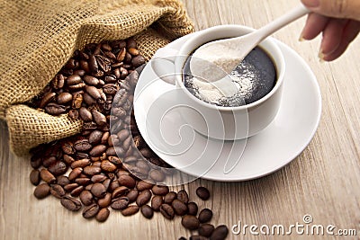 Coffee bean and a spoon milk powder Stock Photo