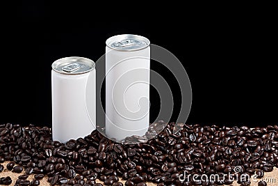 Coffee beans around white cans Stock Photo