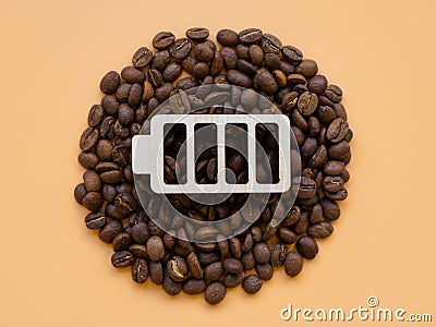 Coffee beans and battery symbol for cheerfulness and energy. Contemporary art concept. Stock Photo