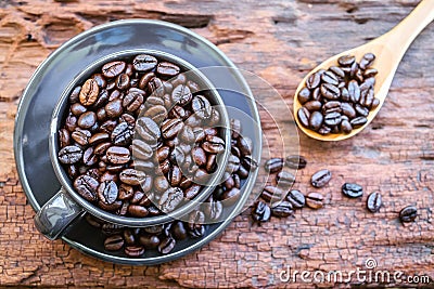 Coffee beans in black cup Stock Photo