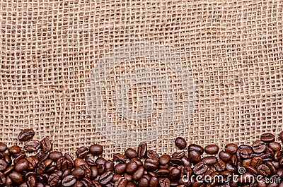 Coffee beans, border on a jute background Stock Photo