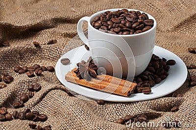 Coffee beans, cinnamon and aniseed in coffee cup Stock Photo