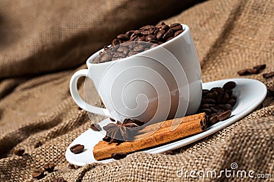 Coffee beans, cinnamon and aniseed in coffee cup. Stock Photo