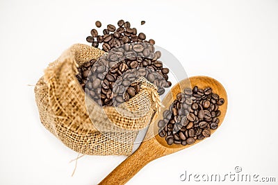 Coffee beans in Cloth bag and wooden spoon Stock Photo