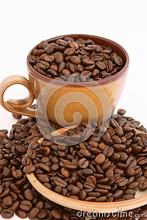 Coffee beans with cup and plate Stock Photo