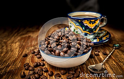 Coffee beans with cup and saucer Stock Photo