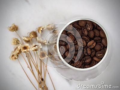 Coffee beans Medium dark roast in the glass. Stock Photo