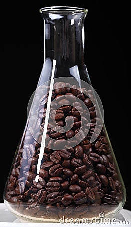 Coffee beans for research in glass flask Stock Photo