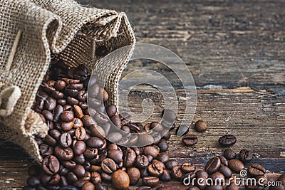 Coffee Beans Spilled out of Burlap Sack Stock Photo