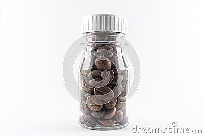 Coffee beans in transparent bottle isolated white background. Caffeine beverage symbol Stock Photo