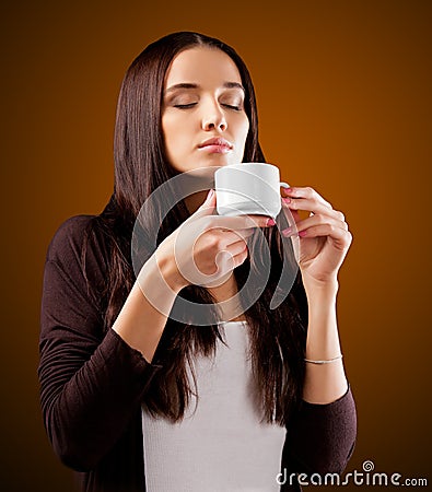 Coffee. Beautiful Girl Drinking Tea or Coffee. Stock Photo