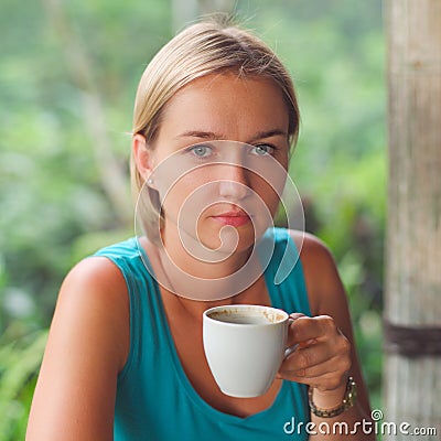 Coffee. Beautiful Girl with glasses drinking Tea Stock Photo