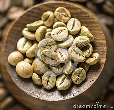 Coffee Beens in wooden box surronded Brown Coffee Beens topshot macro photography close-up aroma of coffee organic seeds Stock Photo