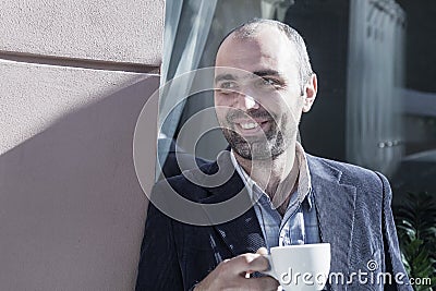 Coffee Break. Sucessful businessman enjoying in a cup of coffee Stock Photo