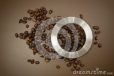 Coffee canister lid and coffee beans scattered on the table Stock Photo