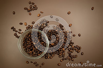 Coffee canister lid and coffee beans scattered on the table Stock Photo