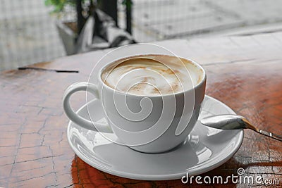 Coffee cappuccino close up on wood background Stock Photo