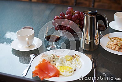 Coffee, cognac and scrambled eggs breakfast Stock Photo