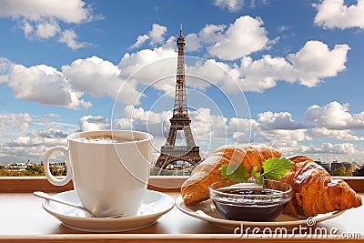 Coffee with croissants against Eiffel Tower in Paris, France Stock Photo