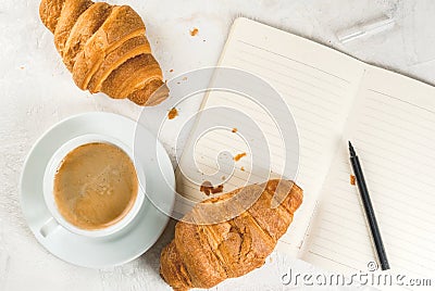 Coffee, croissants and notepad Stock Photo