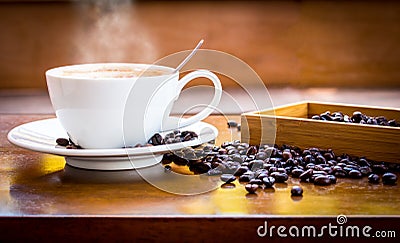 Coffee cup and coffee beans Stock Photo