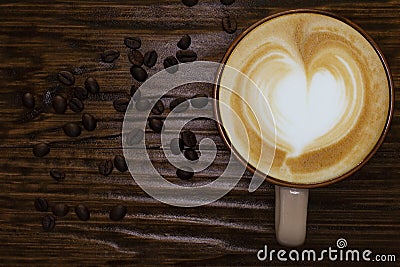 Coffee cup,coffee beans and wood table top view Stock Photo