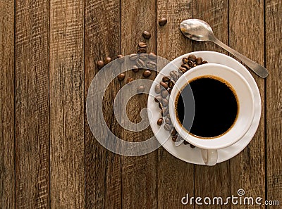 Coffee cup,coffee beans wooden. Stock Photo