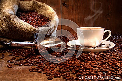 Coffee cup with burlap sack of roasted beans Stock Photo