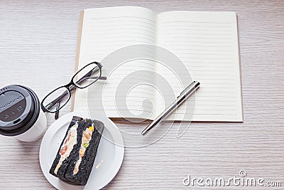 A coffee cup with charcoal sanwiches Stock Photo