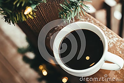 Coffee cup with christmas lights Stock Photo