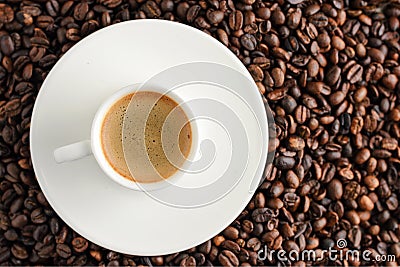 coffee cup espresso on coffee beans backgroun. top view Stock Photo