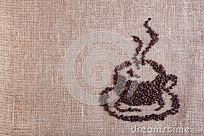 Coffee cup made of beans on burlap background Stock Photo