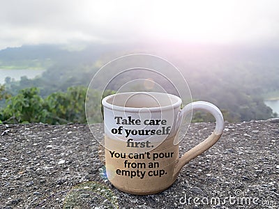 Coffee cup with self love care message on it - Take care of yourself first. You can`t pour from an empty cup. Stock Photo