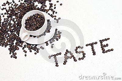 Coffee cup text - 'taste' Stock Photo
