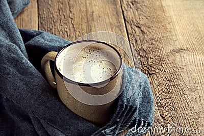 Coffee cup and warm scarf Stock Photo