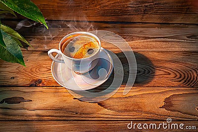 COFFEE CUP ON A WOODEN TABLE Stock Photo