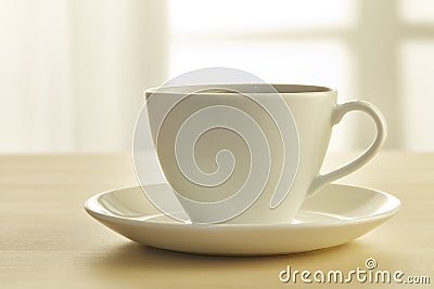 Coffee cup on wooden table Stock Photo