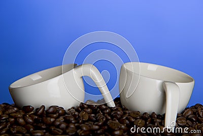 Coffee cups and beans Stock Photo