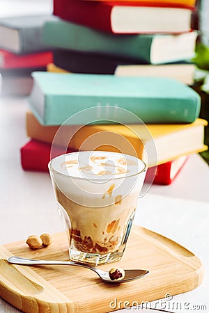 A coffee drink with caramel and pattern on the foam. Stock Photo