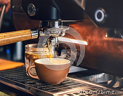 Coffee extraction from professional coffee machine Stock Photo