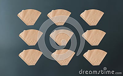 Coffee filter used for american coffee machine on green background with mockup space Stock Photo