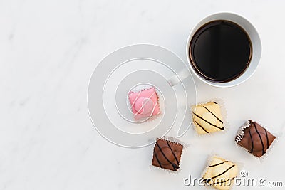 Coffee and French fondant cakes on white marble background Stock Photo