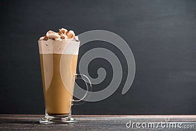 Coffee in glass on the dark wooden table Stock Photo