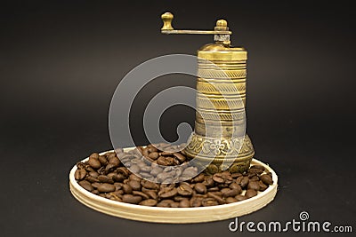 Coffee grinder with coffee beans on wooden table Stock Photo